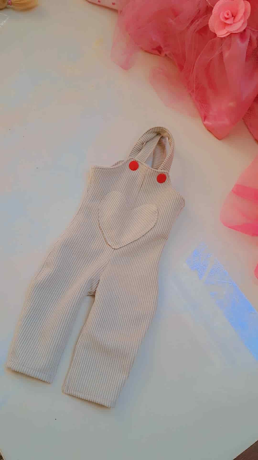لـباس دمية